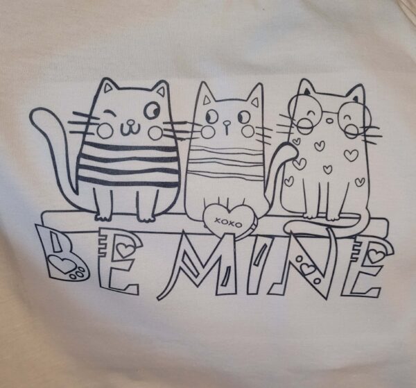 close up of BE MINE colouring t-shirt